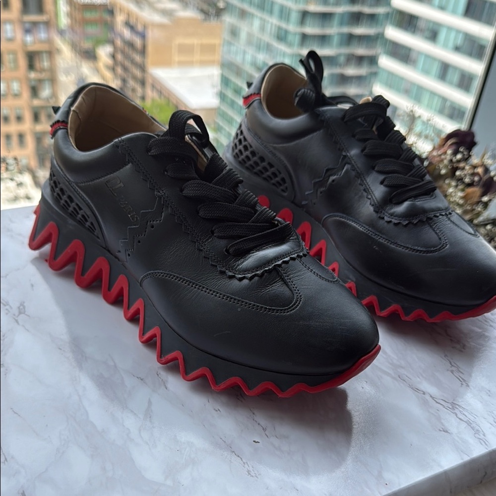 Christian Louboutin Black and Red Sneakers with Bold Design